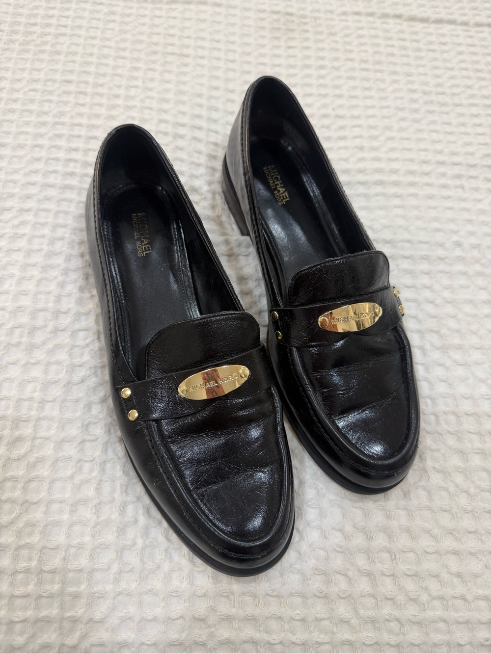 Michael Kors Black Leather Loafers with Gold Plaque Accent
